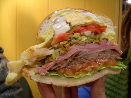 The Uruguayan Chivito A roast beef sandwich with lettuce, tomato, cheese, basil garlic mayo, hard boiled egg, pickles, red peppers, green olives, onions, ham, and bacon on a white bread bun. (Submitted by Phillip Penix-Tadsen)