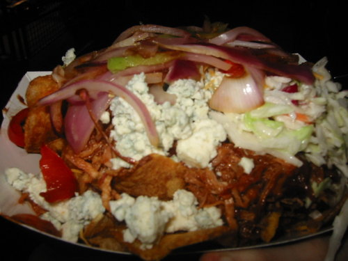 Kentucky Nachos Potato chips covered in barbecued pulled pork, blue cheese, coleslaw, cheddar cheese and sauteed onions and peppers. (submitted by Lila Leatherman)